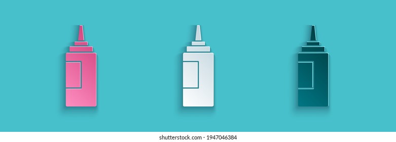 Paper cut Sauce bottle icon isolated on blue background. Ketchup, mustard and mayonnaise bottles with sauce for fast food. Paper art style. Vector