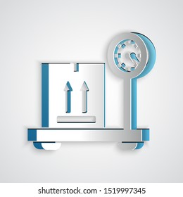 Paper cut Scale with cardboard box icon isolated on grey background. Logistic and delivery. Weight of delivery package on a scale. Paper art style. Vector Illustration