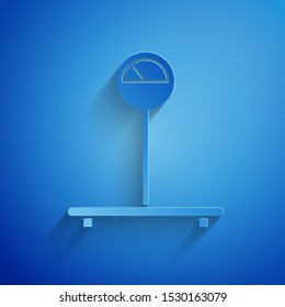 Paper cut Scale icon isolated on blue background. Logistic and delivery. Weight of delivery package on a scale. Paper art style. Vector Illustration