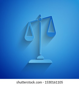 Paper cut Scales of justice icon isolated on blue background. Court of law symbol. Balance scale sign. Paper art style. Vector Illustration
