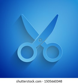 Paper cut Scissors icon isolated on blue background. Cutting tool sign. Paper art style. Vector Illustration