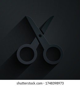 Paper cut Scissors icon isolated on black background. Cutting tool sign. Paper art style. Vector Illustration