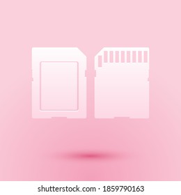Paper cut SD card icon isolated on pink background. Memory card. Adapter icon. Paper art style. Vector.