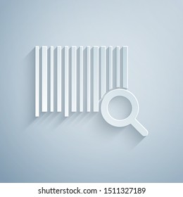 Paper cut Search barcode icon isolated on grey background. Magnifying glass searching barcode. Barcode label sticker. Research barcode. Paper art style. Vector Illustration