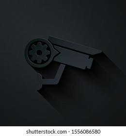 Paper cut Security camera and gear icon isolated on black background. Adjusting app, service concept, setting options, maintenance, repair, fixing. Paper art style. Vector Illustration