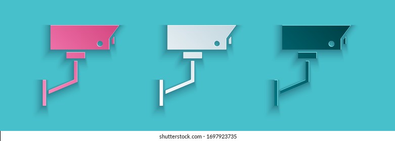 Paper cut Security camera icon isolated on blue background. Paper art style. Vector Illustration