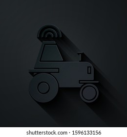 Paper cut Self driving wireless tractor on a smart farm icon isolated on black background. Smart agriculture implement element. Paper art style. Vector Illustration
