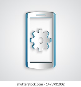 Paper cut Setting on smartphone icon isolated on grey background. Mobile phone and gear. Adjusting, service, setting, maintenance, repair, fixing. Paper art style. Vector Illustration