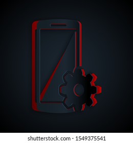 Paper cut Setting on smartphone icon isolated on black background. Mobile phone and gear. Adjusting, service, setting, maintenance, repair, fixing. Paper art style. Vector Illustration