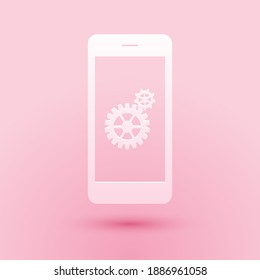 Paper cut Setting on smartphone screen icon isolated on pink background. Mobile and gear. Adjusting app, set options, repair, fixing phone concepts. Paper art style. Vector.