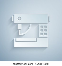 Paper cut Sewing machine icon isolated on grey background. Paper art style. Vector Illustration