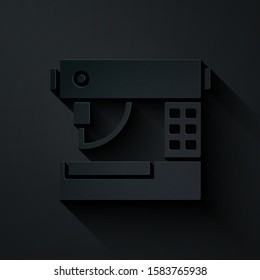Paper cut Sewing machine icon isolated on black background. Paper art style. Vector Illustration