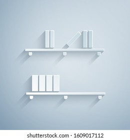 Paper cut Shelf with books icon isolated on grey background. Shelves sign. Paper art style. Vector Illustration