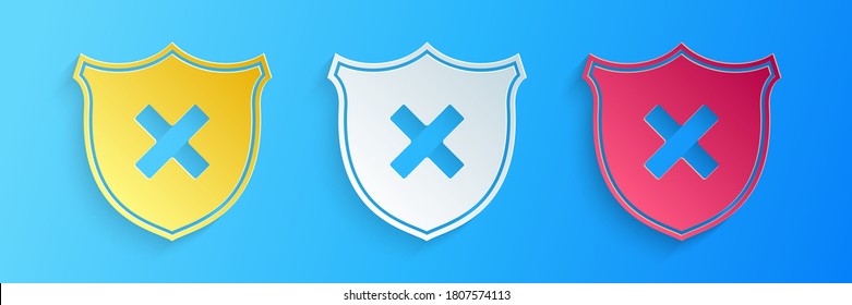 Paper cut Shield and cross x mark icon isolated on blue background. Denied disapproved sign. Protection, safety, security concept. Paper art style. Vector.