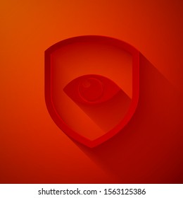 Paper cut Shield and eye icon isolated on red background. Security, safety, protection, privacy concept. Paper art style. Vector Illustration