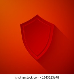 Paper cut Shield icon isolated on red background. Guard sign. Paper art style. Vector Illustration