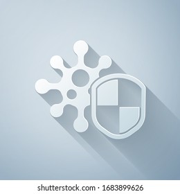 Paper cut Shield protecting from virus, germs and bacteria icon isolated on grey background. Immune system concept. Corona virus 2019-nCoV. Paper art style. Vector Illustration