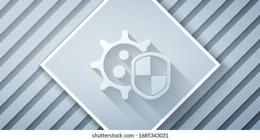 Paper cut Shield protecting from virus, germs and bacteria icon isolated on grey background. Immune system concept. Corona virus 2019-nCoV. Paper art style. Vector Illustration