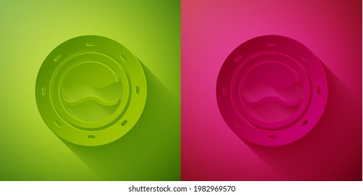 Paper cut Ship porthole with rivets and seascape outside icon isolated on green and pink background. Paper art style. Vector