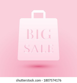 Paper cut Shoping bag with an inscription Big Sale icon isolated on pink background. Handbag sign. Woman bag icon. Female handbag sign. Paper art style. Vector.
