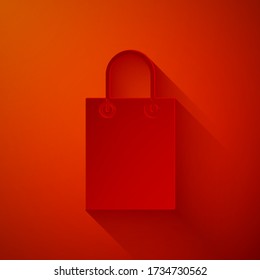 Paper cut Paper shopping bag icon isolated on red background. Package sign. Paper art style. Vector Illustration