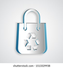 Paper cut Paper shopping bag with recycle icon isolated on grey background. Bag with recycling symbol. Paper art style. Vector Illustration