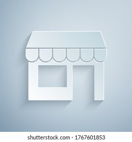 Paper cut Shopping building or market store icon isolated on grey background. Shop construction. Paper art style. Vector