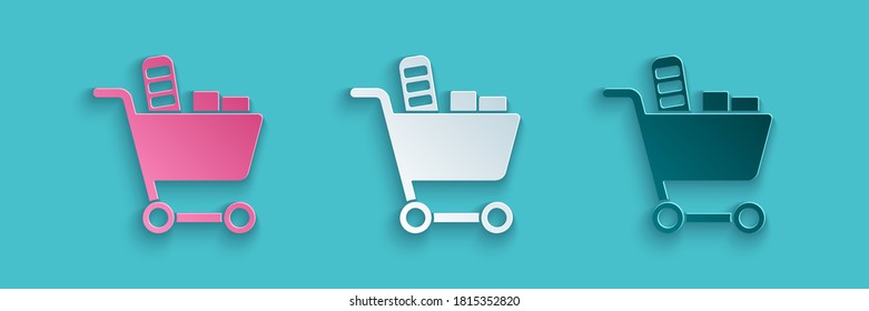 Paper cut Shopping cart and food icon isolated on blue background. Food store, supermarket. Paper art style. Vector