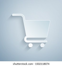 Paper cut Shopping cart icon isolated on grey background. Online buying concept. Delivery service sign. Supermarket basket symbol. Paper art style. Vector Illustration
