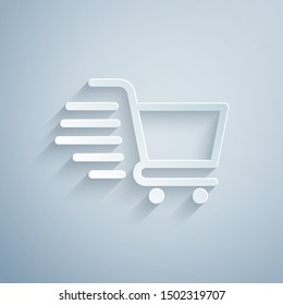 Paper cut Shopping cart icon isolated on grey background. Online buying concept. Delivery service sign. Supermarket basket symbol. Paper art style. Vector Illustration