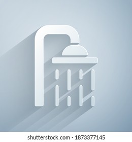 Paper cut Shower head with water drops flowing icon isolated on grey background. Paper art style. Vector