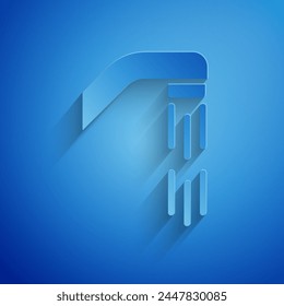 Paper cut Shower head with water drops flowing icon isolated on blue background. Paper art style. Vector