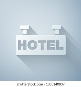 Paper cut Signboard outdoor advertising with text Hotel icon isolated on grey background. Paper art style. Vector