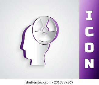 Paper cut Silhouette of a human head and a radiation symbol icon isolated on grey background. Paper art style. Vector