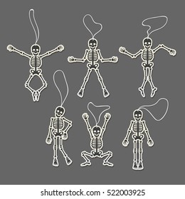 Paper cut skeletons set in different poses. Vector illustration