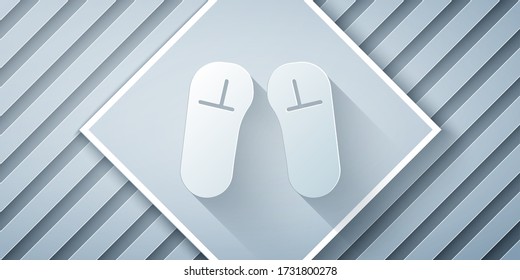 Paper cut Slipper icon isolated on grey background. Flip flops sign. Paper art style. Vector Illustration