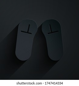 Paper cut Slipper icon isolated on black background. Flip flops sign. Paper art style. Vector Illustration