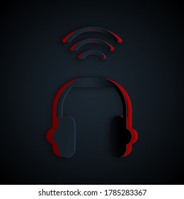 Paper cut Smart headphones system icon isolated on black background. Internet of things concept with wireless connection. Paper art style. Vector