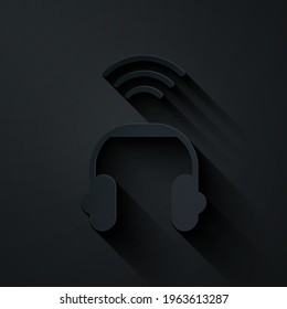 Paper cut Smart headphones system icon isolated on black background. Internet of things concept with wireless connection. Paper art style. Vector