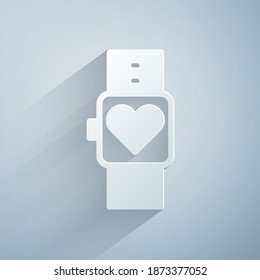 Paper cut Smart watch showing heart beat rate icon isolated on grey background. Fitness App concept. Paper art style. Vector