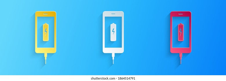 Paper cut Smartphone battery charge icon isolated on blue background. Phone with a low battery charge and with USB connection. Paper art style. Vector.