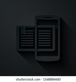 Paper cut Smartphone and book icon isolated on black background. Online learning or e-learning concept. Paper art style. Vector Illustration