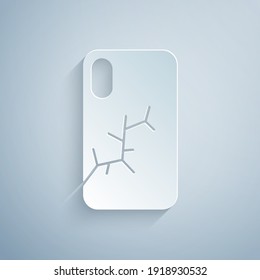 Paper cut Smartphone with broken screen icon isolated on grey background. Shattered phone screen icon. Paper art style. Vector.