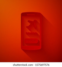 Paper cut Smartphone with electronic boarding pass airline ticket icon isolated on red background. Passenger plane mobile ticket for web and app. Paper art style. Vector Illustration