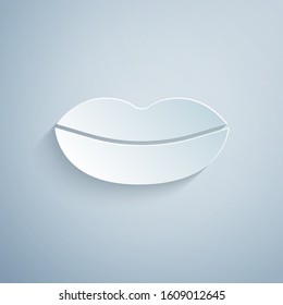 Paper cut Smiling lips icon isolated on grey background. Smile symbol. Paper art style. Vector Illustration