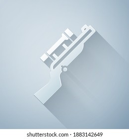 Paper cut Sniper rifle with scope icon isolated on grey background. Paper art style. Vector