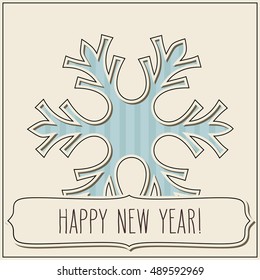 Paper cut snowflake and a frame with New Year greetings in vintage colors.