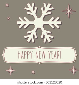 Paper cut snowflake and a frame with New Year greetings over vintage brown backgrounds.