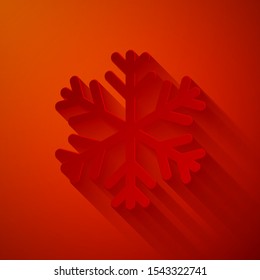 Paper cut Snowflake icon isolated on red background. Paper art style. Vector Illustration