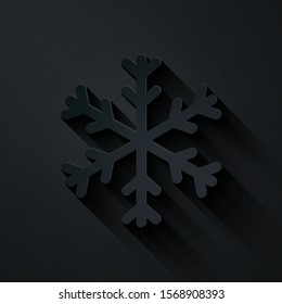 Paper cut Snowflake icon isolated on black background. Paper art style. Vector Illustration